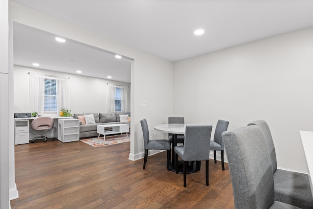 dining room with dark wood-type flooring