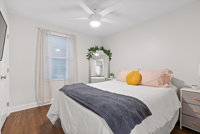 bedroom featuring ceiling fan and dark wood-type flooring