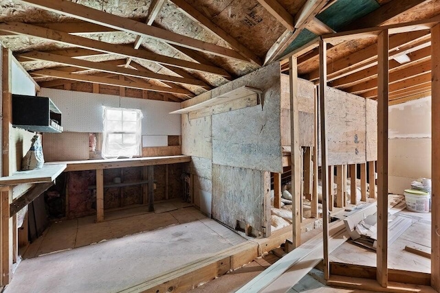 misc room with lofted ceiling