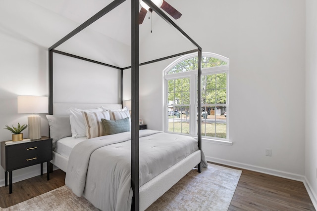 bedroom with ceiling fan and dark hardwood / wood-style floors