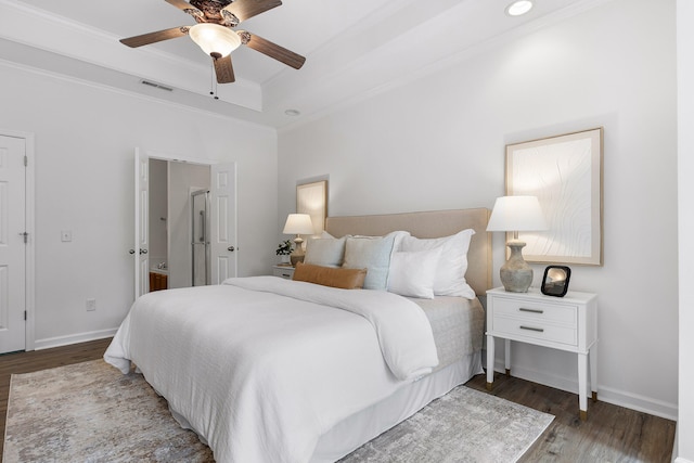 bedroom with ornamental molding, ceiling fan, and dark wood-type flooring