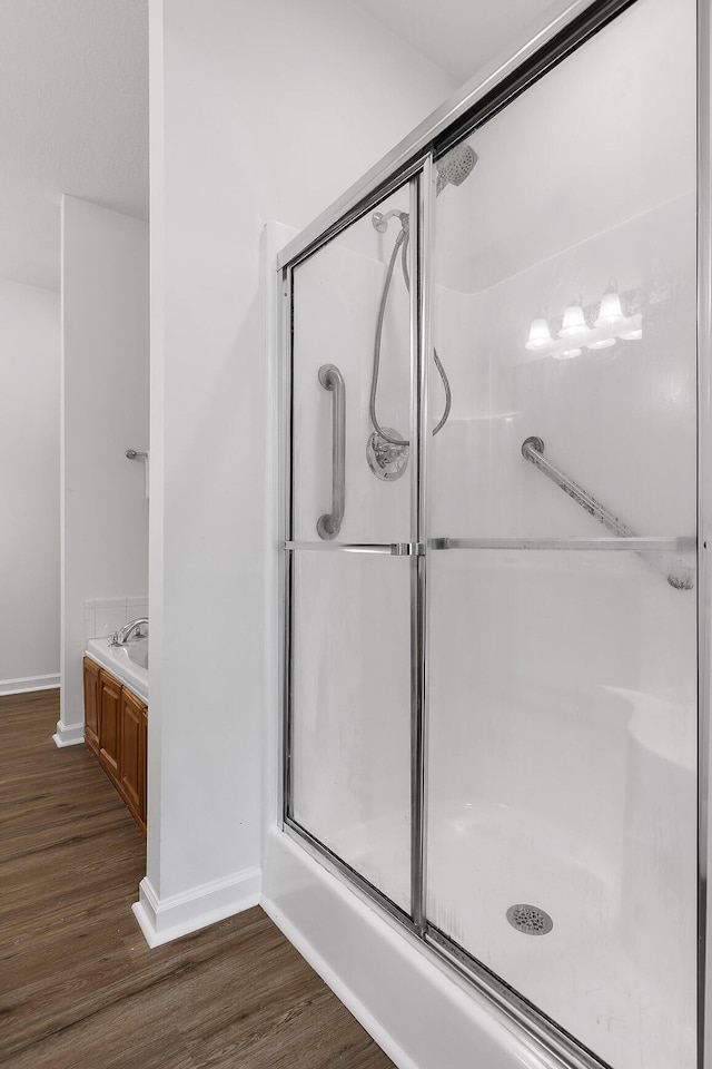 bathroom with wood-type flooring