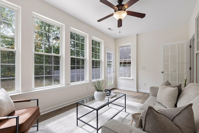 interior space with ceiling fan and light hardwood / wood-style floors