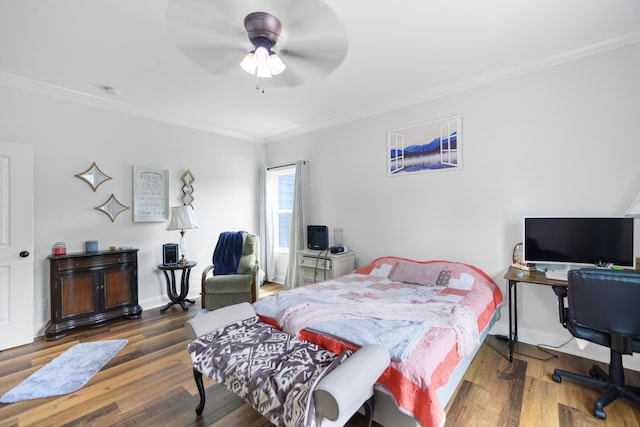 bedroom with ceiling fan, dark hardwood / wood-style floors, and ornamental molding