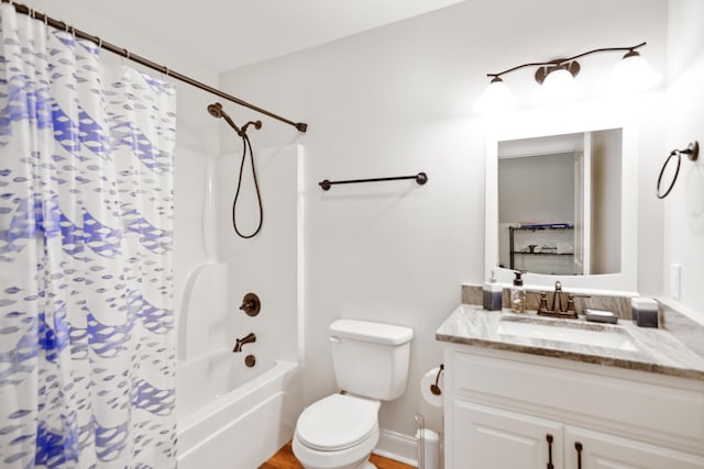 full bathroom featuring toilet, vanity, and shower / bathtub combination with curtain