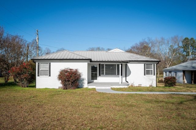 ranch-style home featuring a front yard