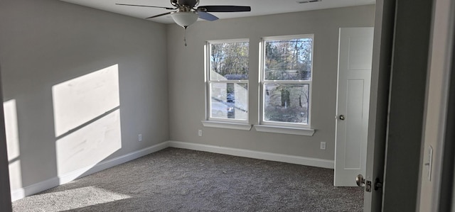 carpeted empty room featuring ceiling fan