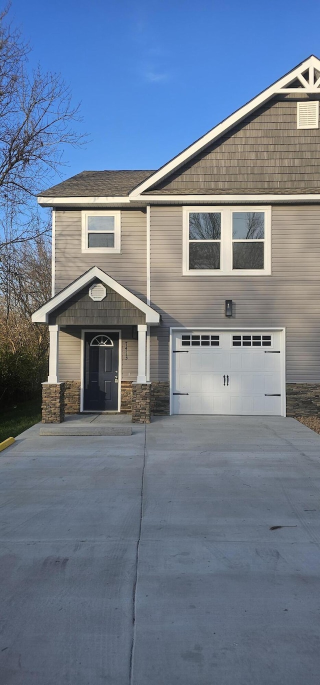 view of front of home with a garage