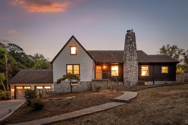 modern inspired farmhouse with a garage