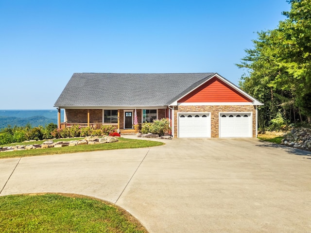 view of front of home featuring covered porch and a garage