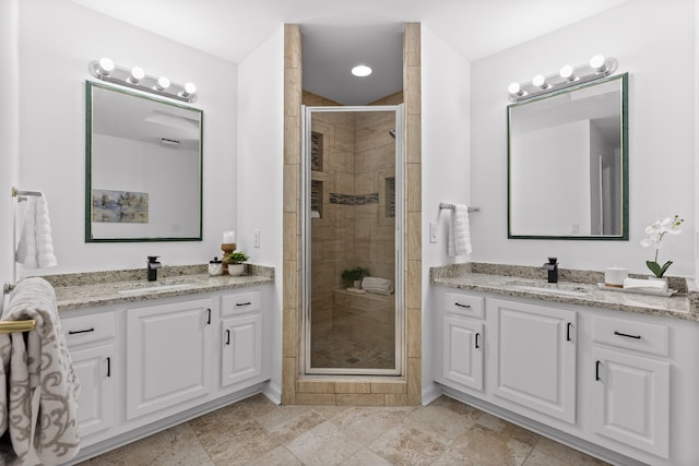 bathroom with an enclosed shower and vanity