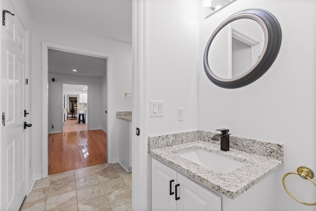 bathroom featuring wood-type flooring and vanity