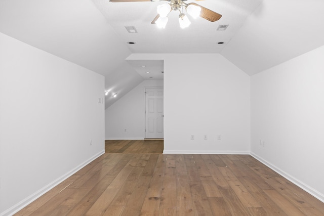 bonus room featuring light hardwood / wood-style flooring, lofted ceiling, and ceiling fan