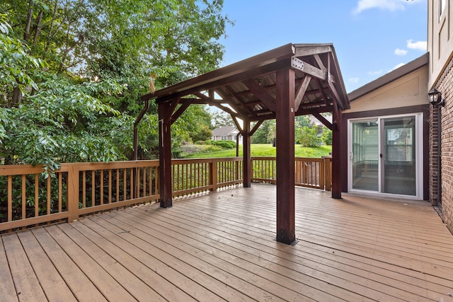 wooden terrace featuring a gazebo