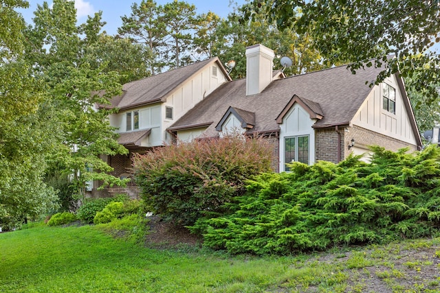 view of property exterior with a yard