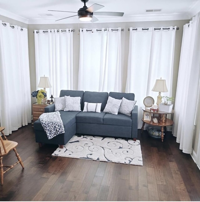 living room featuring ornamental molding, ceiling fan, and dark hardwood / wood-style flooring