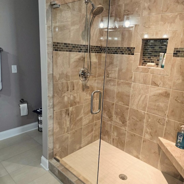 bathroom featuring tile patterned flooring and a shower with door