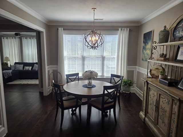 dining room with ceiling fan with notable chandelier, dark hardwood / wood-style floors, and ornamental molding