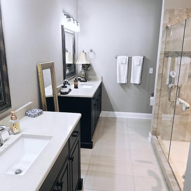 bathroom with vanity, tile patterned floors, and a shower with shower door