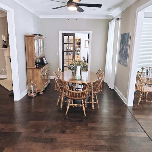 dining area with crown molding, dark hardwood / wood-style floors, and ceiling fan