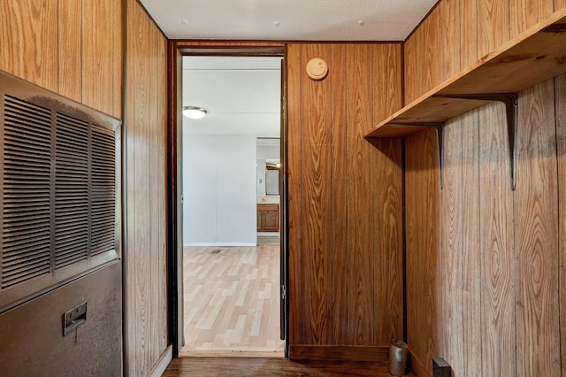 mudroom featuring wood walls and dark hardwood / wood-style flooring