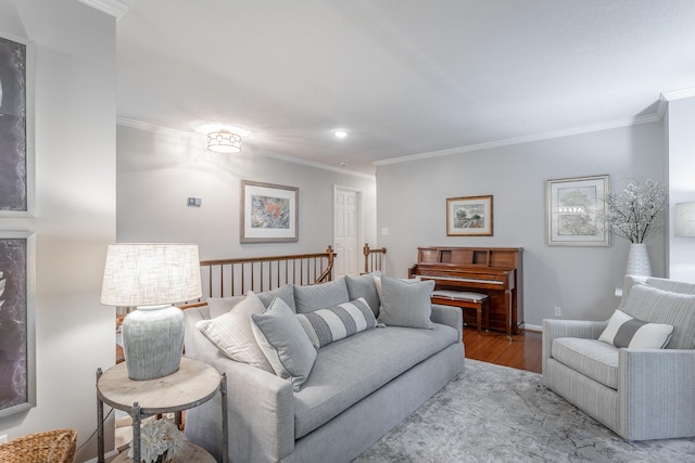 living room with ornamental molding and light wood-type flooring