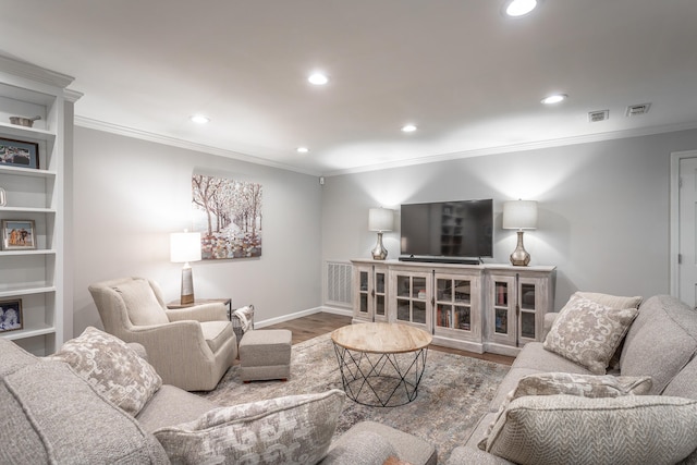 living room featuring crown molding and hardwood / wood-style floors