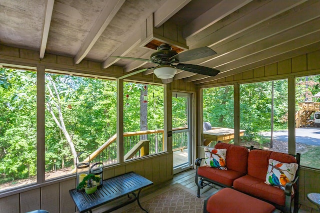 sunroom with vaulted ceiling, ceiling fan, and plenty of natural light