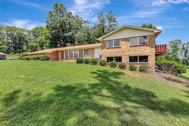 split level home with a front yard