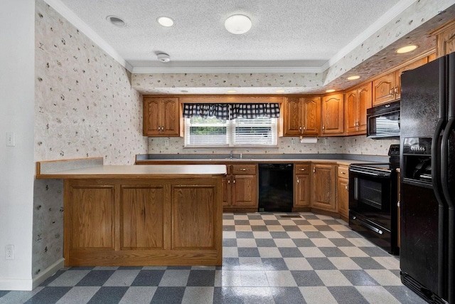 kitchen with black appliances, a textured ceiling, and crown molding