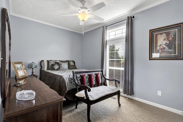 carpeted bedroom with ceiling fan, a textured ceiling, and ornamental molding