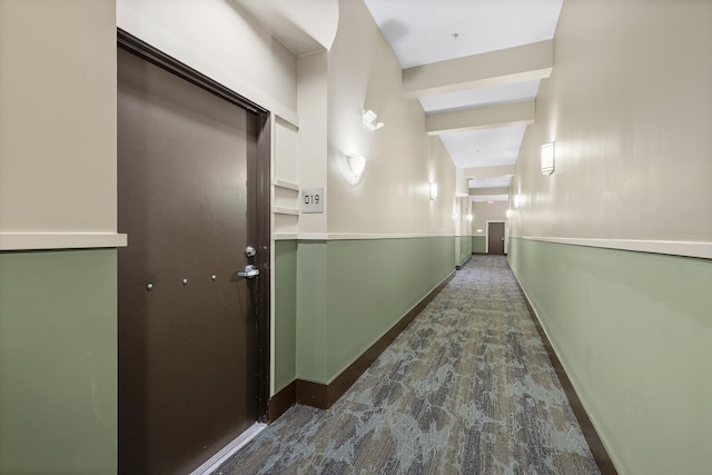 corridor with dark hardwood / wood-style flooring