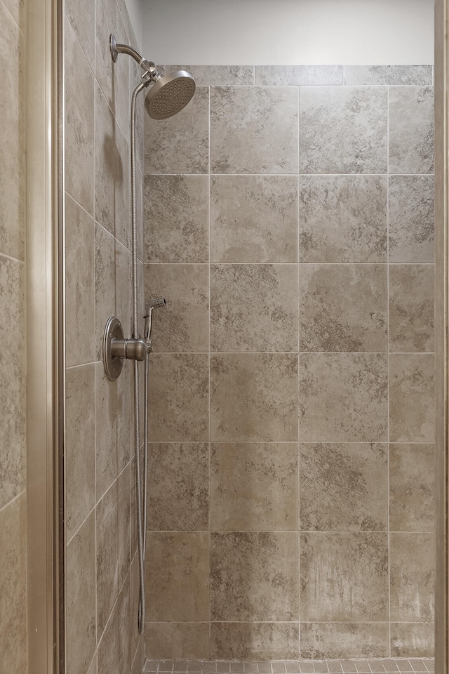 details with a tile shower