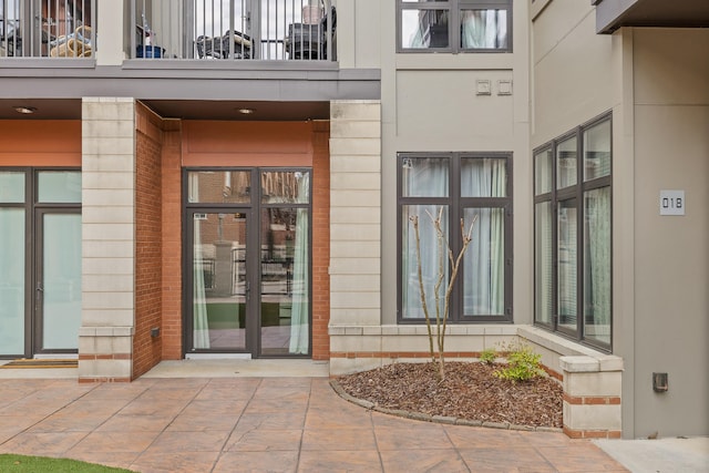 entrance to property featuring a balcony