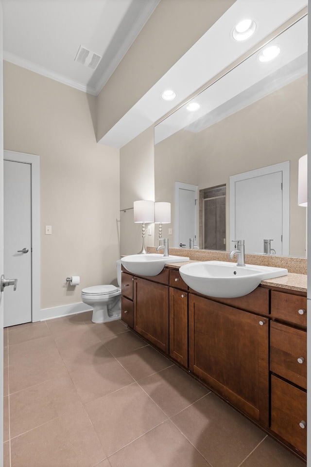 bathroom with vanity, walk in shower, ornamental molding, toilet, and tile patterned floors