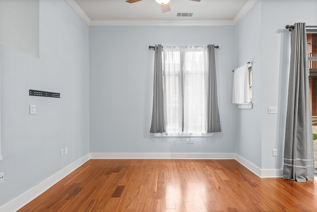 spare room featuring ceiling fan, ornamental molding, and hardwood / wood-style floors