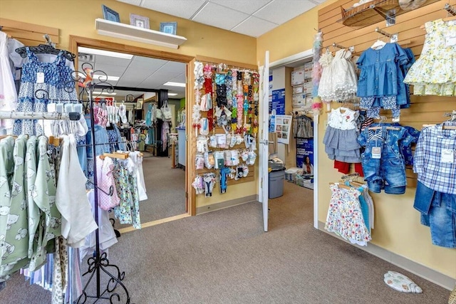 spacious closet featuring carpet floors and a drop ceiling