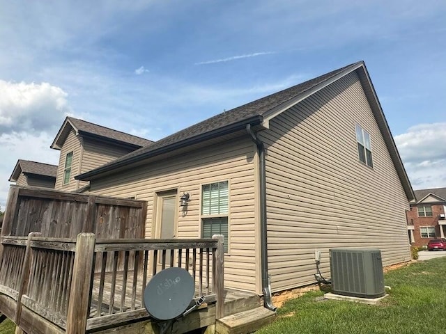 exterior space with cooling unit and a wooden deck