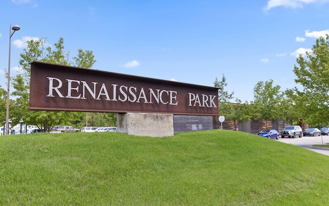 community sign with a lawn