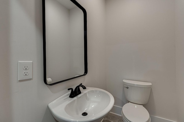 bathroom with sink and toilet