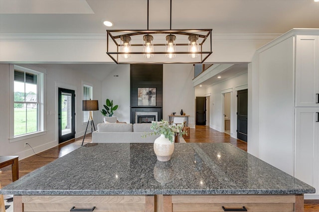111 Arthur Ln, Cleveland, TN 37312 - kitchen featuring ornamental molding, open floor plan, wood finished floors, white cabinets, and dark stone counters