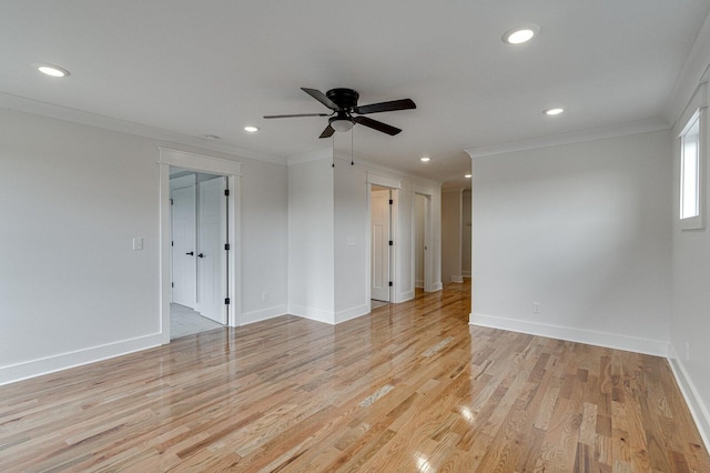 unfurnished room featuring light wood-type flooring, ceiling fan, and crown molding