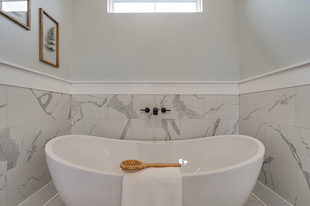 105 Arthur Ln, Cleveland, TN 37312 - full bathroom with tile walls, a freestanding tub, and wainscoting