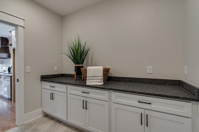 105 Arthur Ln, Cleveland, TN 37312 - kitchen with white cabinetry, light wood-style floors, range, and dark stone countertops