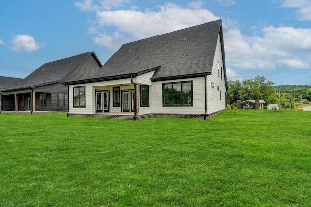 105 Arthur Ln, Cleveland, TN 37312 - back of house featuring ceiling fan, a yard, roof with shingles, and a patio area