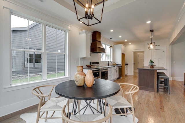 105 Arthur Ln, Cleveland, TN 37312 - dining room with baseboards, light wood finished floors, recessed lighting, ornamental molding, and a chandelier