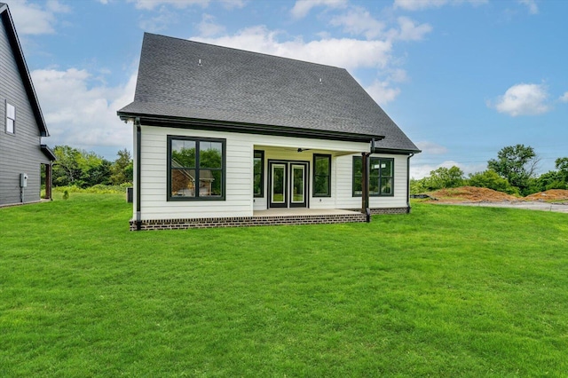 105 Arthur Ln, Cleveland, TN 37312 - back of property featuring a yard, a shingled roof, and a patio