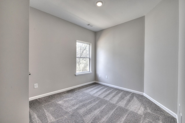 empty room featuring carpet flooring