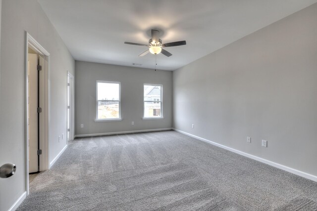 carpeted empty room with ceiling fan