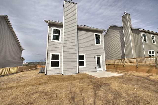 back of property featuring a patio and central AC